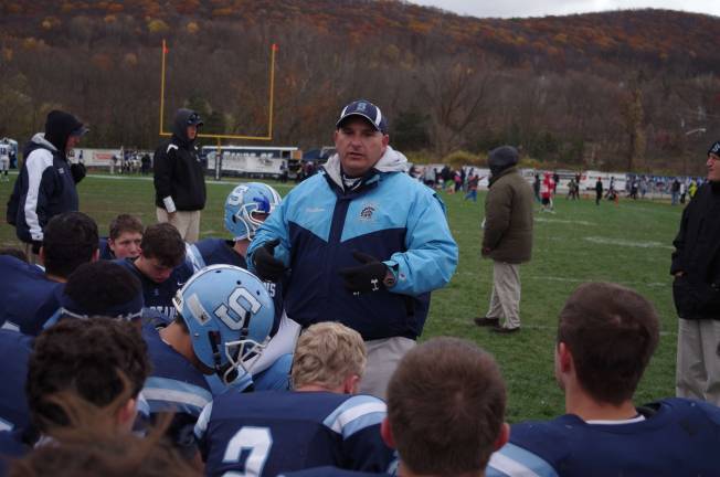 Head Coach Frank Marchiano speak to his team during a game earlier in the season. Sparta will play River Dell for the state championship Saturday at MetLife Stadium.