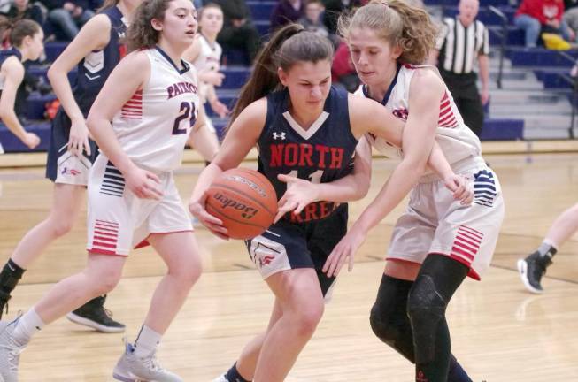 North Warren's Maddie Allen handles the ball in the first quarter. Allen scored 4 points.