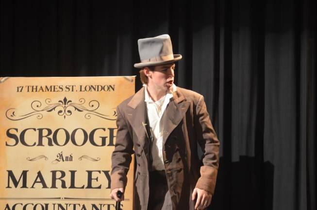 Pope John XXIII Regional High School senior Hunter Gallo, playing the role of Ebenezer Scrooge, acts out a scene during rehearsal of the Pope John Players’ production of “A Christmas Carol” on Monday at Pope John XXIII Regional High School.