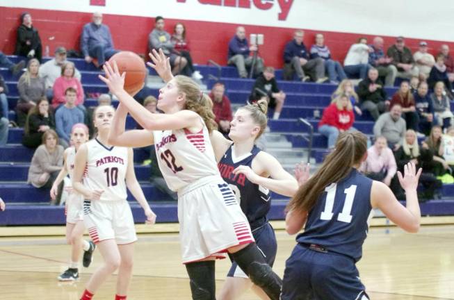 Lenape Valley's Brienna Pangborn handles the ball during a shot in the first quarter. Pangborn scored 19 points, grabbed 10 rebounds and is credited with 1 steal.