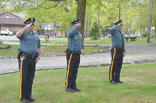 Former Mayor Richard Bowe concludes remarks as Boy Scouts from Troop 276 prepare to raise the colors. (Photo provided)