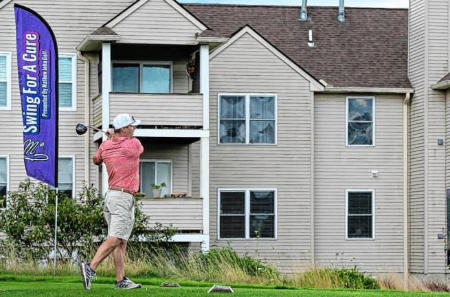 Swinging into success <b>Mathew John Golf hosted Swing for a Cure, a charity golf outing Aug. 12 for the Lupus Foundation of America.</b>