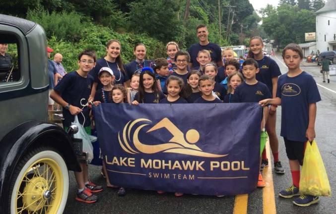 Swim Team marching in the 4th of July Parade