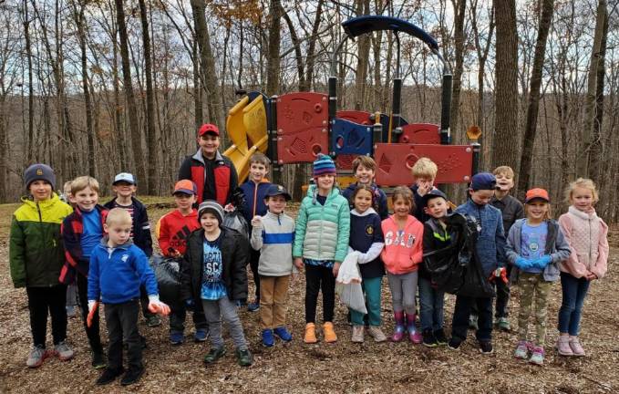 Cub Scout Pack 295 this weekend cleaned up local parks, including Edison Park.