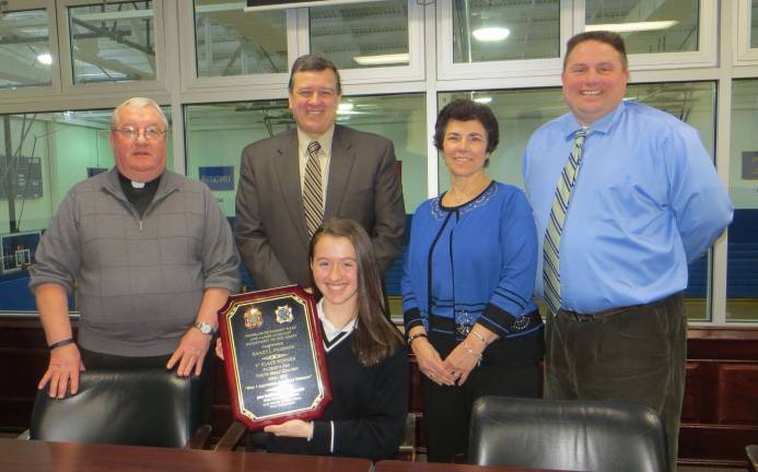 Local student wins patriotic essay contest Hailey O’Connor, holding plaque, with Rev. Msgr. Kieran McHugh, President, Thomas Costello, Principal, Jo-Ann Higgs, eighth grade teacher, and Vin Bello, Vice Principal.