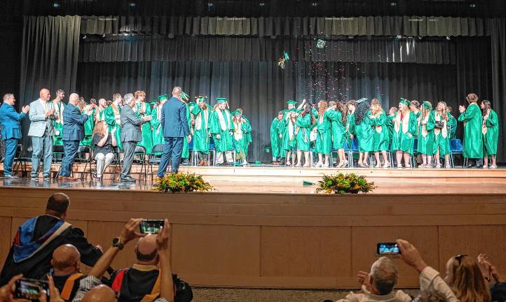Photos: Sussex County Technical School graduation Caps and confetti fly through the air at the end of graduation.