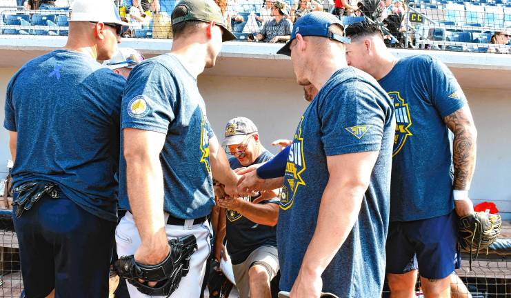 Photos: Battle of the Badges III <b>Players gather before the charity softball game between the New Jersey and the Pennsylvania state police.</b>