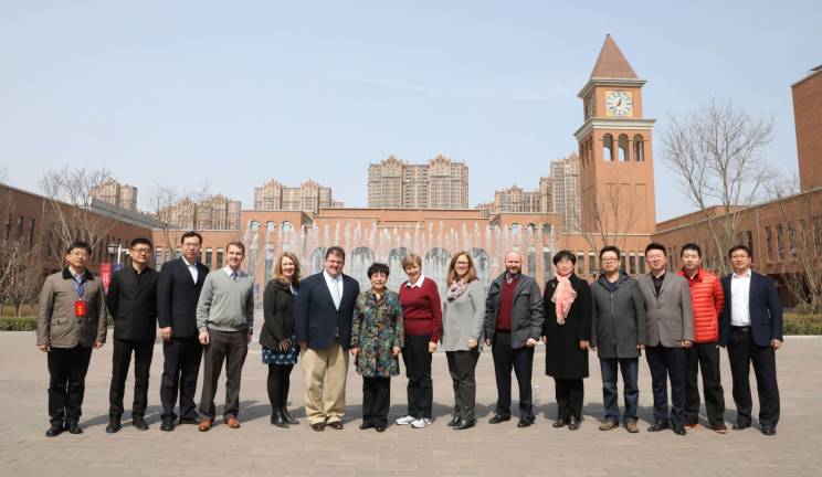 Pope John XXIII Regional High School Vice President for Institutional Advancement Craig Austin and Cultural Exchange Program Director Mary Alice Campbell, fifth and sixth from left, pose for a group picture with officials from the Shijiazhuang No. 2 Middle School and the Runde School of Shijiazhuang on the campus of Runde School of Shijiazhuang in Shijiazhuang, China.