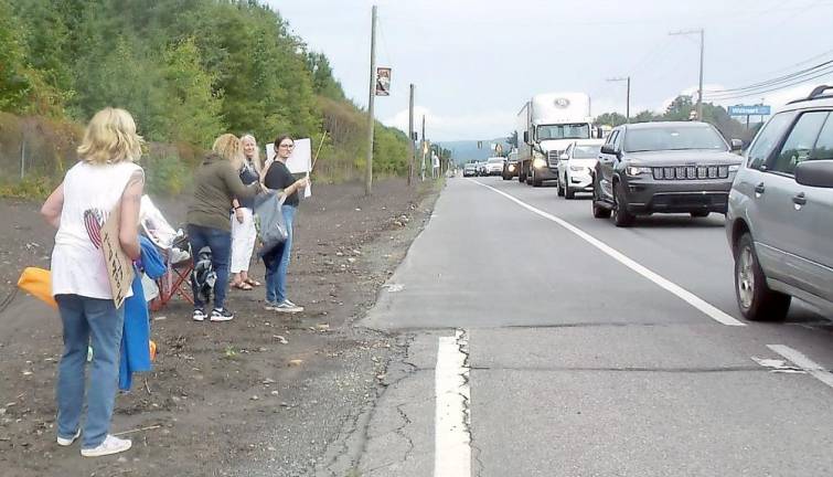 Anti-mask protestor in the afternoon before the meeting, on the highway across from Delaware Valley High School (Photo by Frances Ruth Harris)