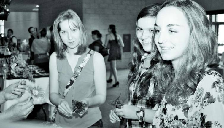 Girls, girls and more girls Bridget Hagdon, Katie Callahan and Melissa Terhune all of Sparta made flower pens at the girl scout vendor table.