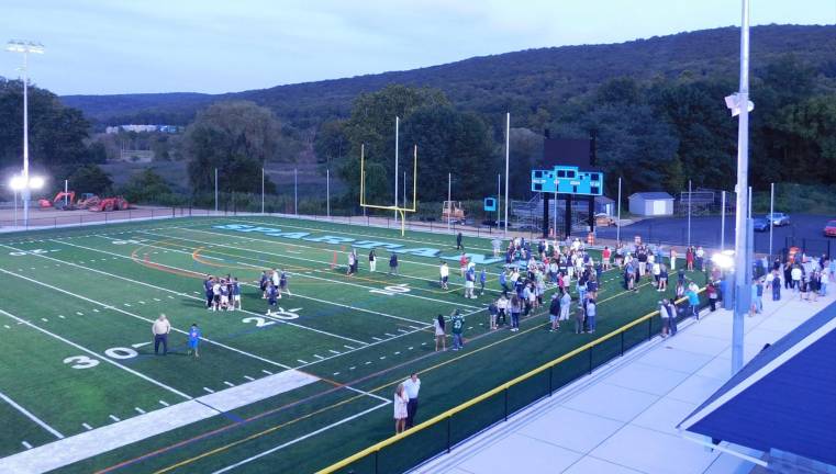 Sparta students and residents check out the new turf field at Sparta High School after a ribbon cutting ceremony on Monday, Aug 26, 2019.