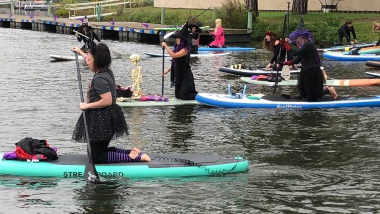 Participants in the Witches Paddle fundraiser set off from the Lake Mohawk Country Club in Sparta. (Photo by Kathy Shwiff)
