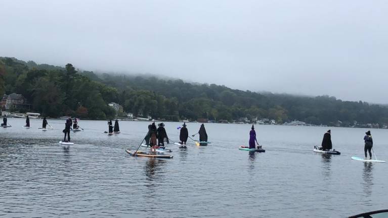 Participants in the Witches Paddle spread out on Lake Mohawk. (Photo by Kathy Shwiff)
