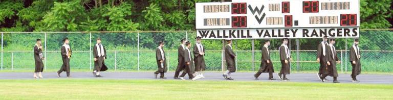 Students pass the 2020 scoreboard. (Photo by Vera Olinsky)