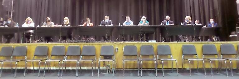 From left: Ashley Zimmerman, solicitor; Dawn Bukaj; Felicia Sheehan; Pat Lutfy; Jessica Decker, vice-president; Jack Fisher, president; Corey Homer; Rosemary Walsh; Dr. John Bell, superintendent; Julie Ewald, recording secretary. Corey Homer arrived after the vote, so did not vote. Brian Carso teaches a class on Tuesday night so was not present. (Photo by Frances Ruth Harris)