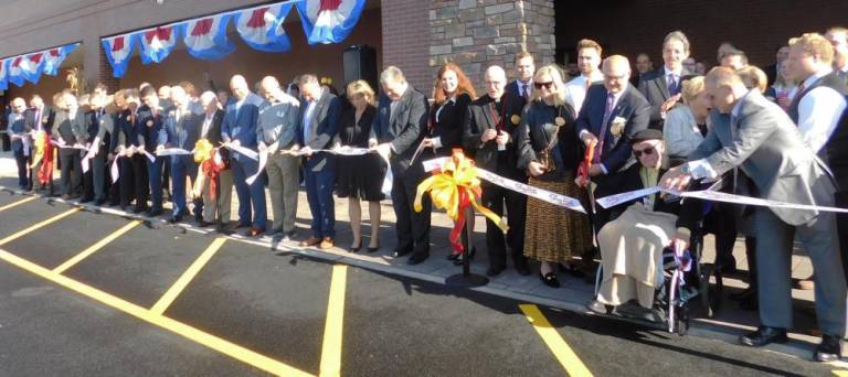 (L) Members of the ShopRite leadership team, local dignitaries (C), and the Romano family (R) cut the ribbon to officially open the new ShopRite at North Village on Rt. 15 in Sparta on Wednesday, Oct 23, 2019.