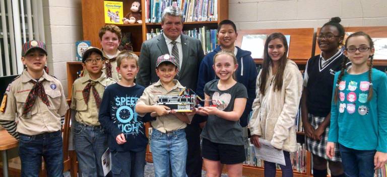 Pope John robotics teams share ideas with Sen. Oroho PJMS Jaguars with Sen. Oroho. Back row: Will, Calvin, Zoe, Mika, Felicia. Front row: Frank, Eldrin, Chris, James, Ally