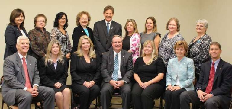 Regional President and Chief Operating Officer Bob Vandenbergh stands with colleagues celebrating 20 or more years of service with Lakeland Bank. Standing left to right: Karen Garrera, Gail Martin, Ana Arajuo, Eileen Diehl, Karen Drossel, Joyce Harant, Ellen Codella and Jennifer Scuralli. Seated left to right: Lou Luddecke, Julie Stachura, Lenora McGuire, Keith Niedergall, Destiny Wolff, Mary Karakos and Bill Schachtel. Not pictured: Doug Bedell, Ray Cordts, and Kim Graham.