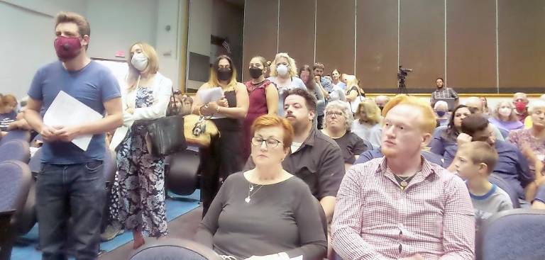 People lined up to address the school board (Photo by Frances Ruth Harris)