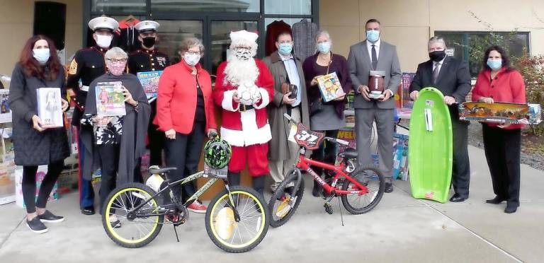 Season of Hope Toy Drive kicks off, hampered by Covid Sussex County Freeholder Director Sylvia Petillo (right), NJ State Senator Steve Oroho (second from right), and Fredon School District Chief School Administrator Matthew Beck (third from right) join Project Self-Sufficiency Board of Directors members, and Santa, at the kick-off of the Season of Hope Toy Drive. (Photo provided)