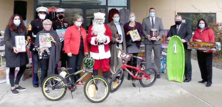 Sussex County Freeholder Director Sylvia Petillo (right), NJ State Senator Steve Oroho (second from right), and Fredon School District Chief School Administrator Matthew Beck (third from right) join Project Self-Sufficiency Board of Directors members, and Santa, at the kick-off of the Season of Hope Toy Drive. (Photo provided)