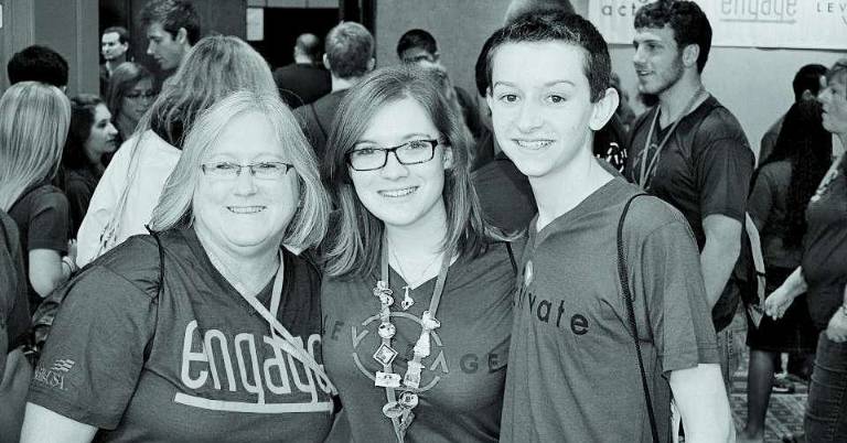 Students attend conference Advisor Cathy Paterson with students Daria Ferdine and Stephen DeVito at the conference