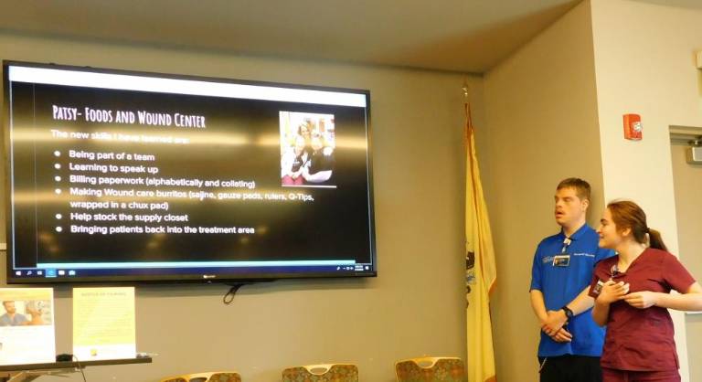 Project SEARCH interns Patrick (L) and Patsy talk about the work they are learning during their internship at the Newton Medical Center during an open house held Tuesday, March 10, 2020.