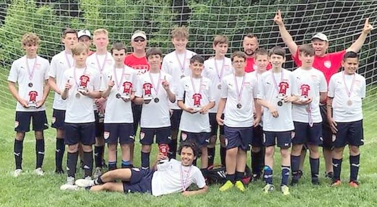 Back row (from left): Robert Hathaway, Justin Arapkiles, Coach Sean Mulligan, Brody Levy, Coach Dave Ruppert, Tyler Ruppert, Kevin Kruczek, Coach Dan Kruczek, Coach Greg Grochulski Second row: Jesse Heulbing, Danny Wraith, Mike Tidona, Daniel Visha, Lewis Rossi, Sam Murphy, Brendan Boen, Matt Grochulski, Anthony Monroy; Front row: Alfredo Lopez. Not pictured: Lucas Sarenella, Alex Yanaga (Photo provided)