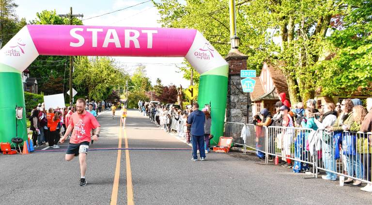 Photos: Girls on the Run Spring 5K Runners cross the finish line.