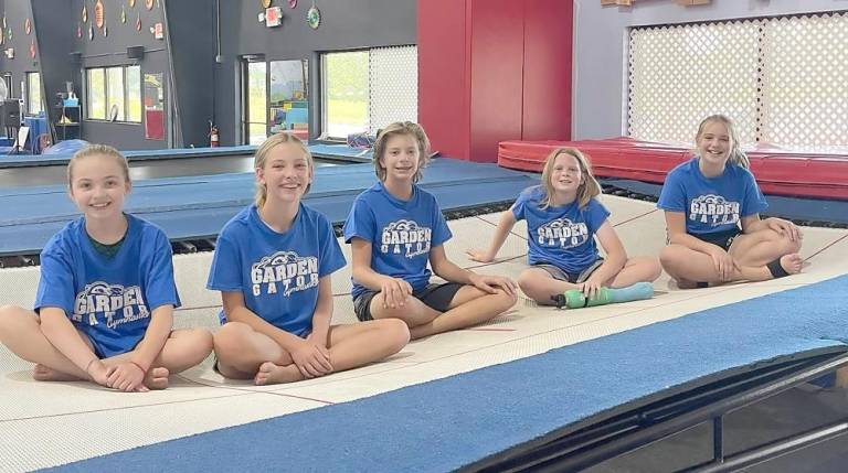 Some of Giant's Garden Gator Trampoline and Tumbling Team seated on the EuroTramp: Claire Trance, Liesl Hessel, Sparta; Gabe Shamy,Byram; Rowan Henrie, Lauren Goff, Sparta (Photo provided)