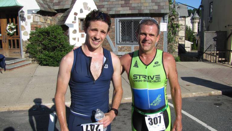 Another big triathlon for Pass it Along Photo courtesy of Pass It Along Overall male winner, Brendan Offer and 8th place overall winner John Mcgurk of Dallas, PA