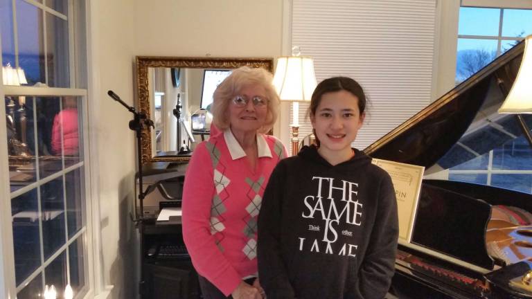 Local pianist competes in annual festival Piano teacher Joan Farrington is pictured with Maiki Batchelor.