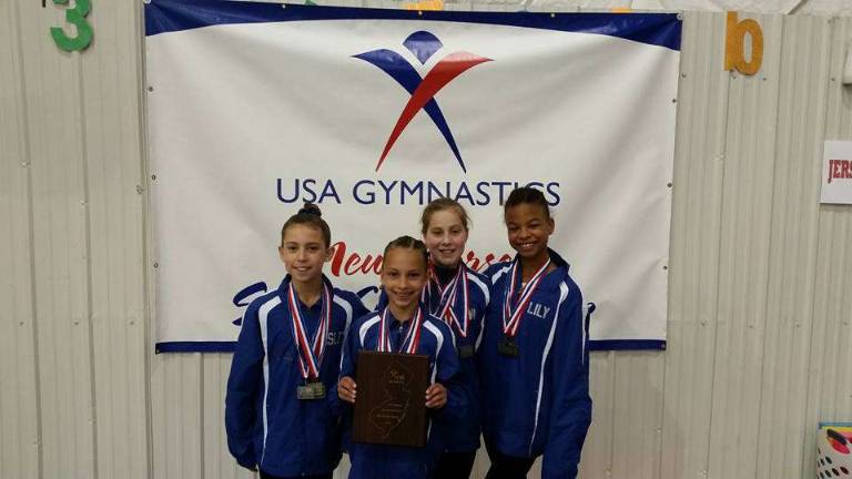 Sparta club gymnasts excel 3rd place for the Bronze team of Giant Gymnastics' Garden Gators Ainsley Mitchell, Emily Harms and Ava Dutro of Sparta, and Lily Kucks of Franklin.