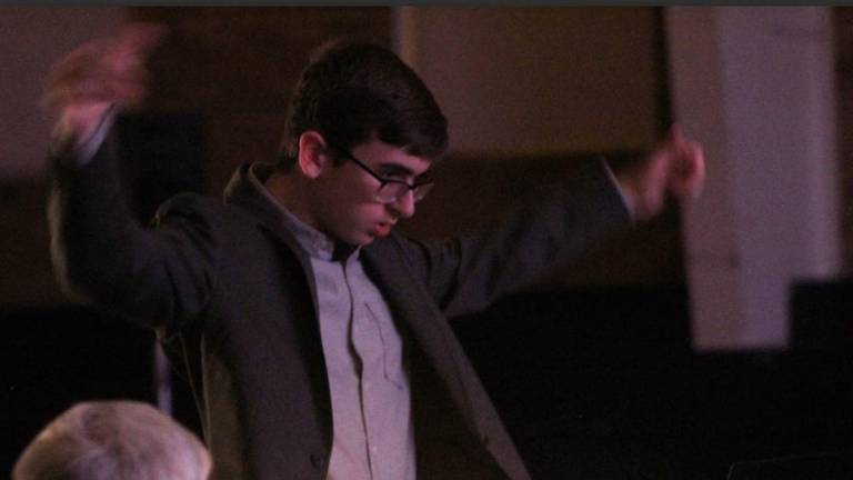 Pope John sophomore Ben Janiszewski conducts a 21-piece orchestra for the musical ‘Chess.’ He will attending the Tanglewood 2023 summer program.