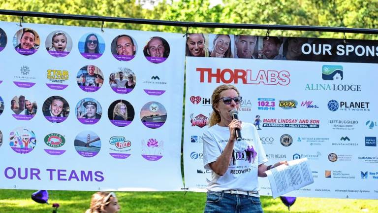 Michele Wolf, executive director of the Center for Prevention &amp; Counseling, speaks at the Change the Face of Addiction Walk last August. (Photos provided)