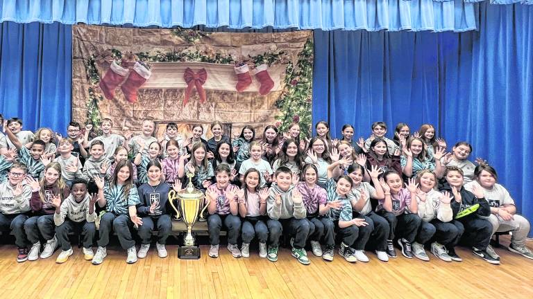 <b>Students from Reverend George A. Brown Memorial School with the Stuff the Stocking trophy.</b>