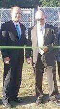 <b>Pictured at a ribbon-cutting (from left) are Assistant Superintendent Dr. Charles McKay and Business Administrator Steve Kepnes.</b>