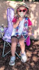 Clara Bohm cools herself off during the parade.