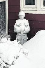 This photo, submitted by reader Janet Knight of Sparta shows a snow-covered knight statue during a recent storm.