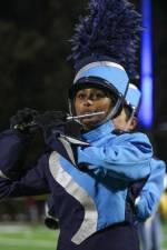 Suvaani Ranasinghe, a junior, plays flute during the halftime show.
