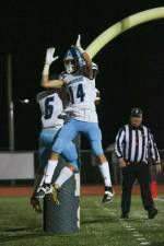 Austin Castorina and Colby Plotss celebrate a touchdown on the Randolph Ram's home field.