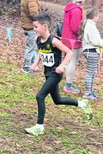 Bode Bagley runs up the hill toward the finish line at Regionals.