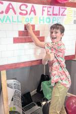 James Kierans updates the Wall of Hope.
