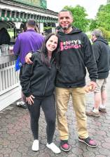 Heather and Ben Davey, the founders of Benny's Bodega, pose for a photo.