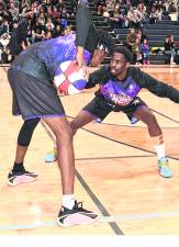 Harlem Wizards players perform.