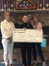 Presenting the donation to Ginnie Littell of Ginnie's House. (Photos provided)