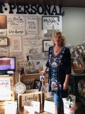 Garlic and Oil owner, Kathryn Kaplan with the store's new and booming Get Personal section.