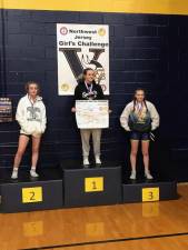 Paige Weiss, center, is Sparta High School’s first state wrestling champion since 1983. (Photo courtesy of Sparta High School)