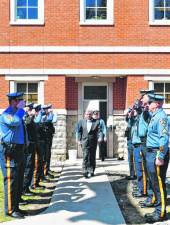 Sparta police officers salute Lt. John Lamon as he leaves for retirement Friday, March 29. (Photos by Maria Kovic)