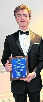 Stone Herbison is shown with his plaque.